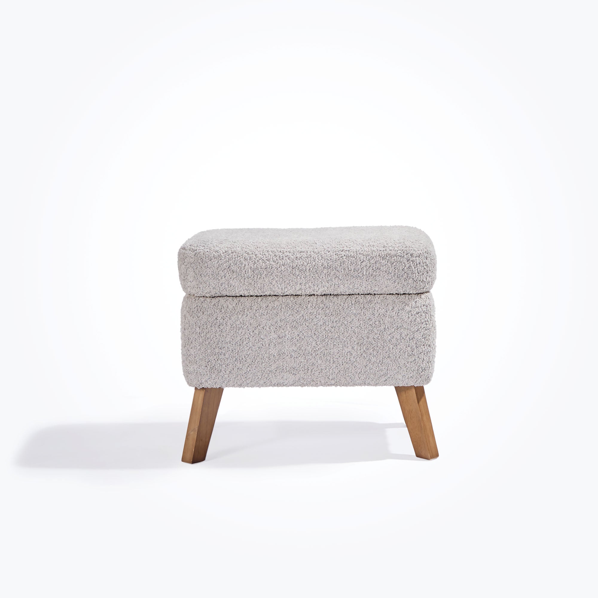 Cutout view of the Harper footstool in boucle cloud grey with oak legs, designed to complement the matching Harper rocking chair.