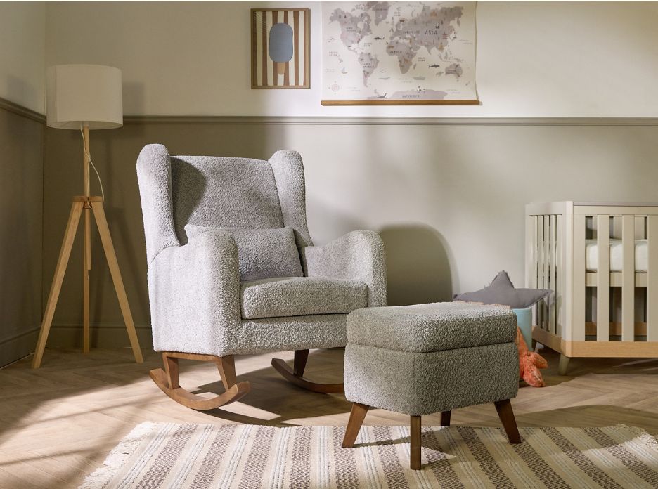 Harper rocking chair and footstool in boucle cloud grey styled in a nursery, with crib, rug, and accessories creating a calm, cosy scene.