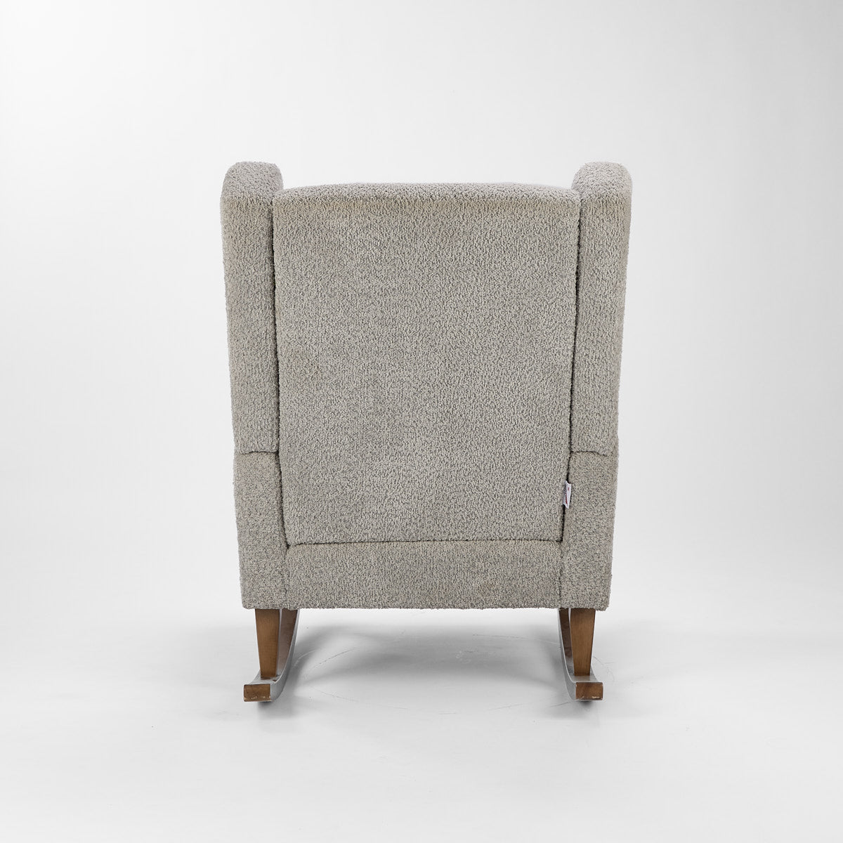 Rear view of the Harper Wingback rocking chair and footstool in cloud grey, showing the supportive high back and curved rocker design.