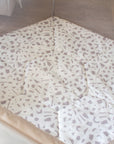 Overhead view of the Hexa Playpen in mushroom terrazzo, highlighting soft padded playmat with abstract mushroom-coloured shapes on white
