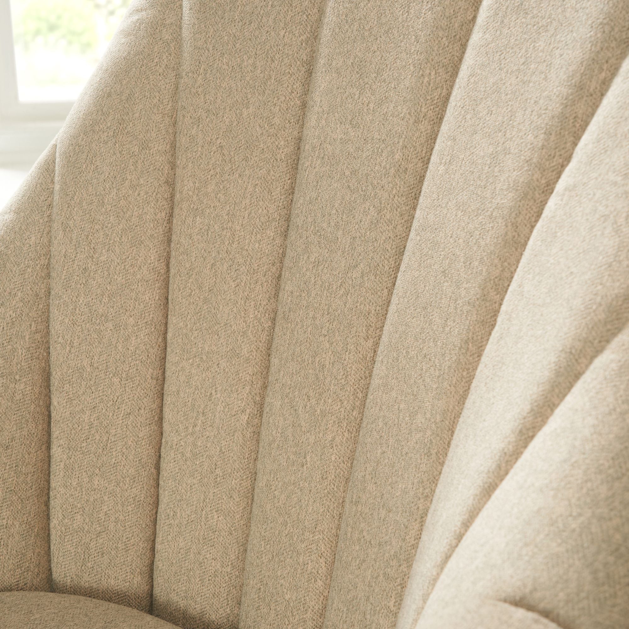 Close-up of the Jonah rocking chair showing the ergonomically cushioned back for comfort and stability, with Scotchgard-treated fabric to help resist stains