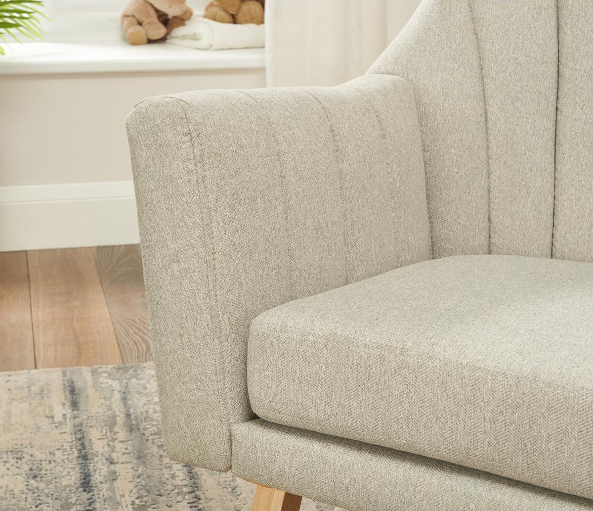 Close-up detail of the padded, cushioned arm and back of the Jonah chair in grey, highlighting comfort and soft upholstery.