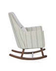 A side view of the Juno rocking chair in cashmere vintage stripe with walnut rocking chair legs in a white background.