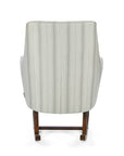 A back view of the Juno rocking chair in cashmere vintage stripe with walnut rocking chair legs in a white background.
