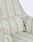 A close up of the Juno rocking chair in cashmere vintage stripe with a matching supportive pillow in a white background.
