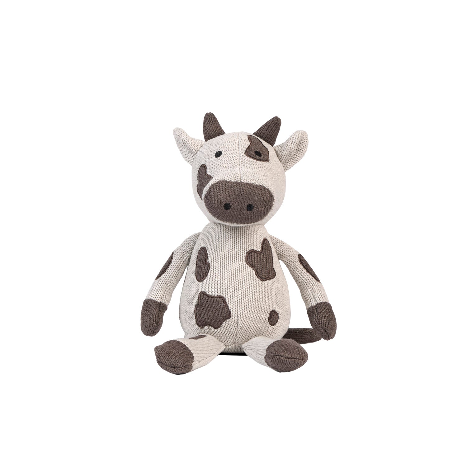 Plush Clemi cow toy sitting on a white background.