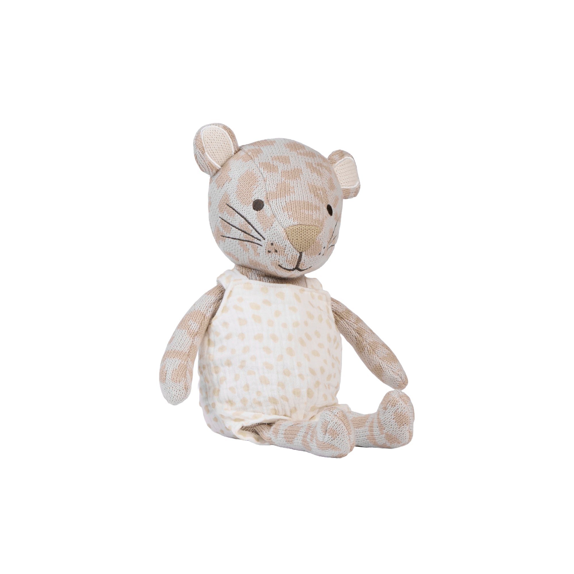 A plush stuffed animal shaped like a small leopard, made from beige and cream spotted fabric, sitting against a plain white background.
