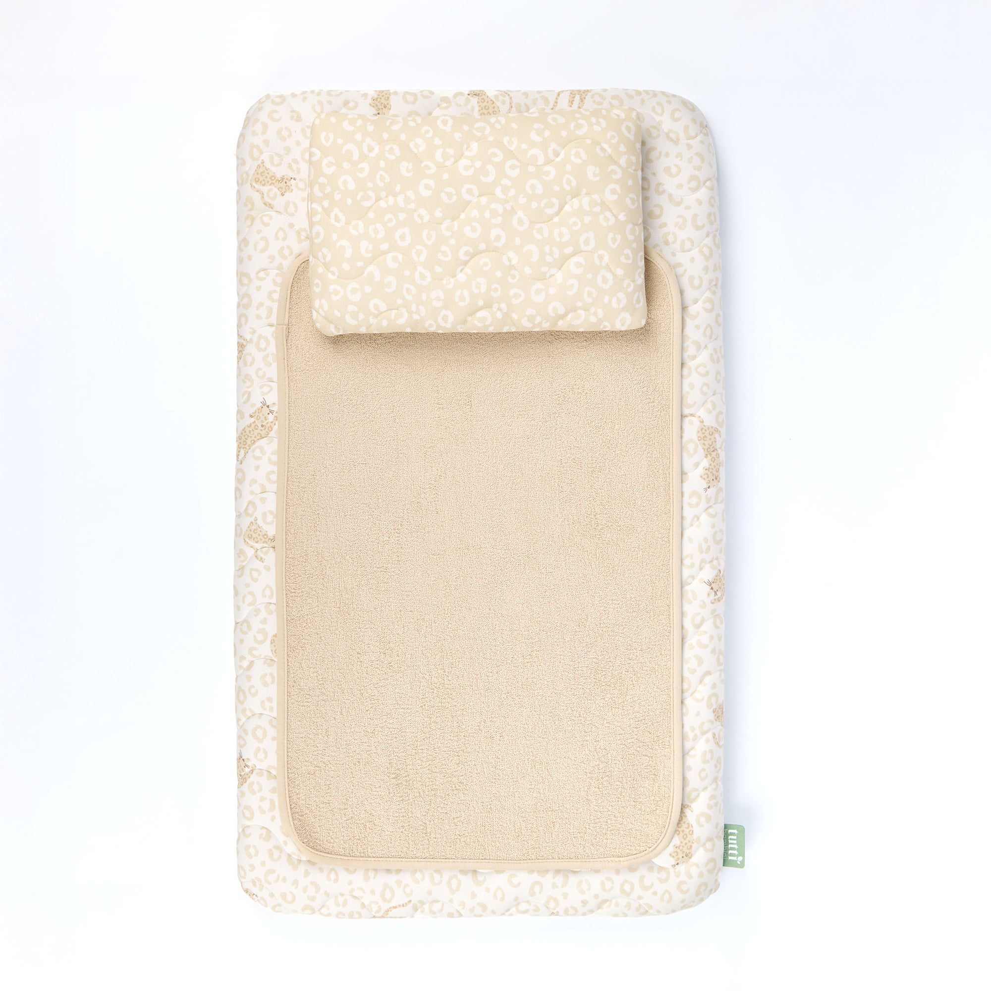 Beige baby changing mat with animal print cover on a white background