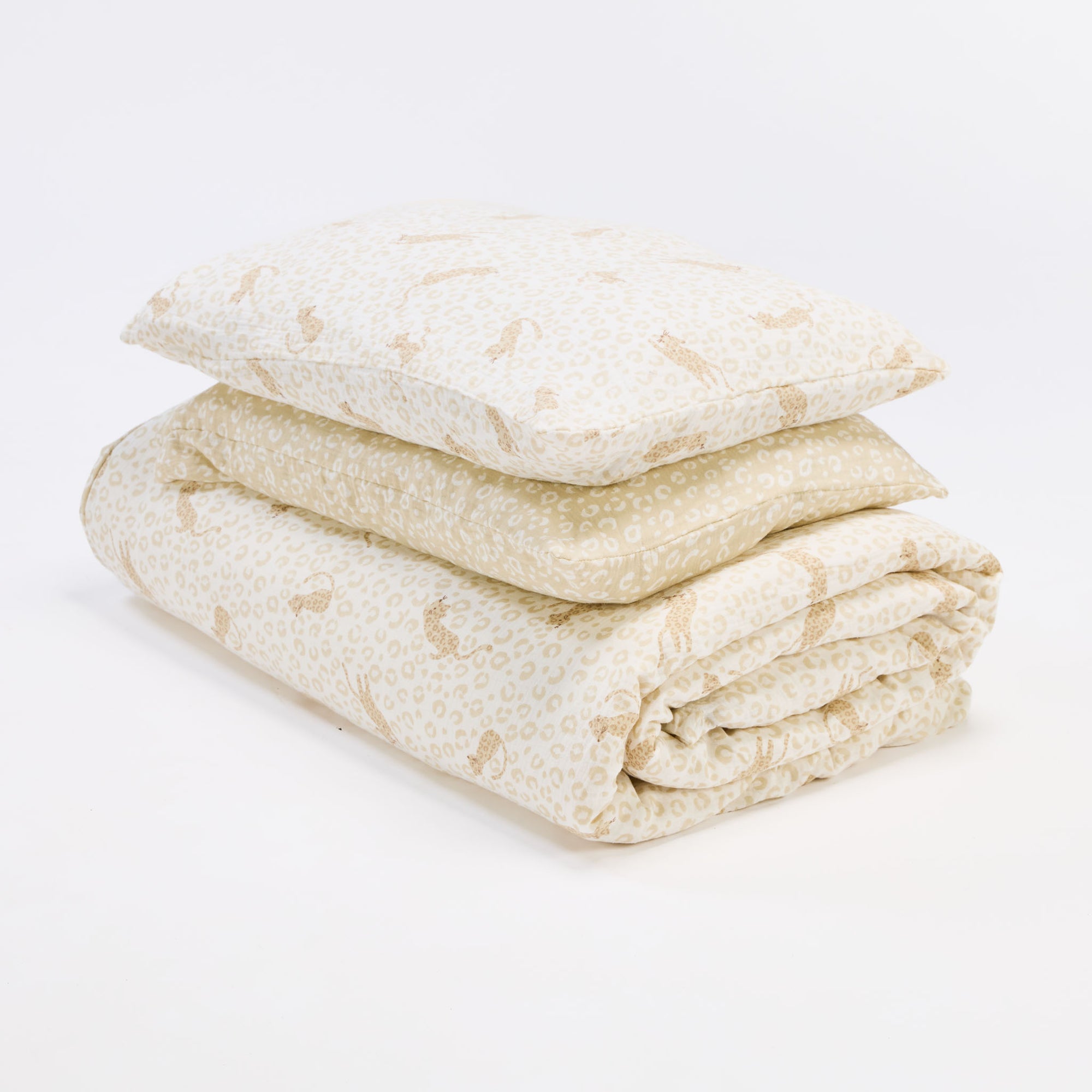 love cats single duvet cover and pillowcases folded and stacked, showcasing coordination in soft beige tones.