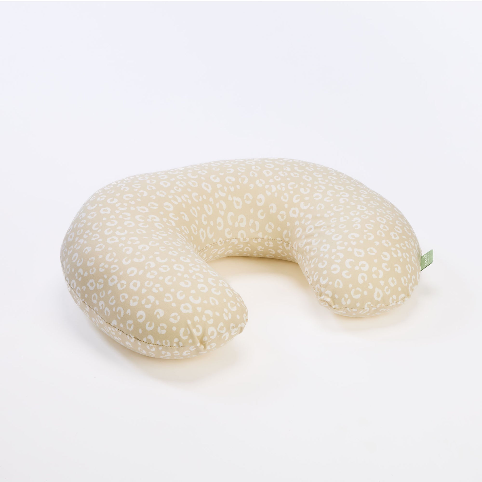 Love Cats feeding pillow in soft beige leopard print, shown in cutout view highlighting its curved shape and supportive design.