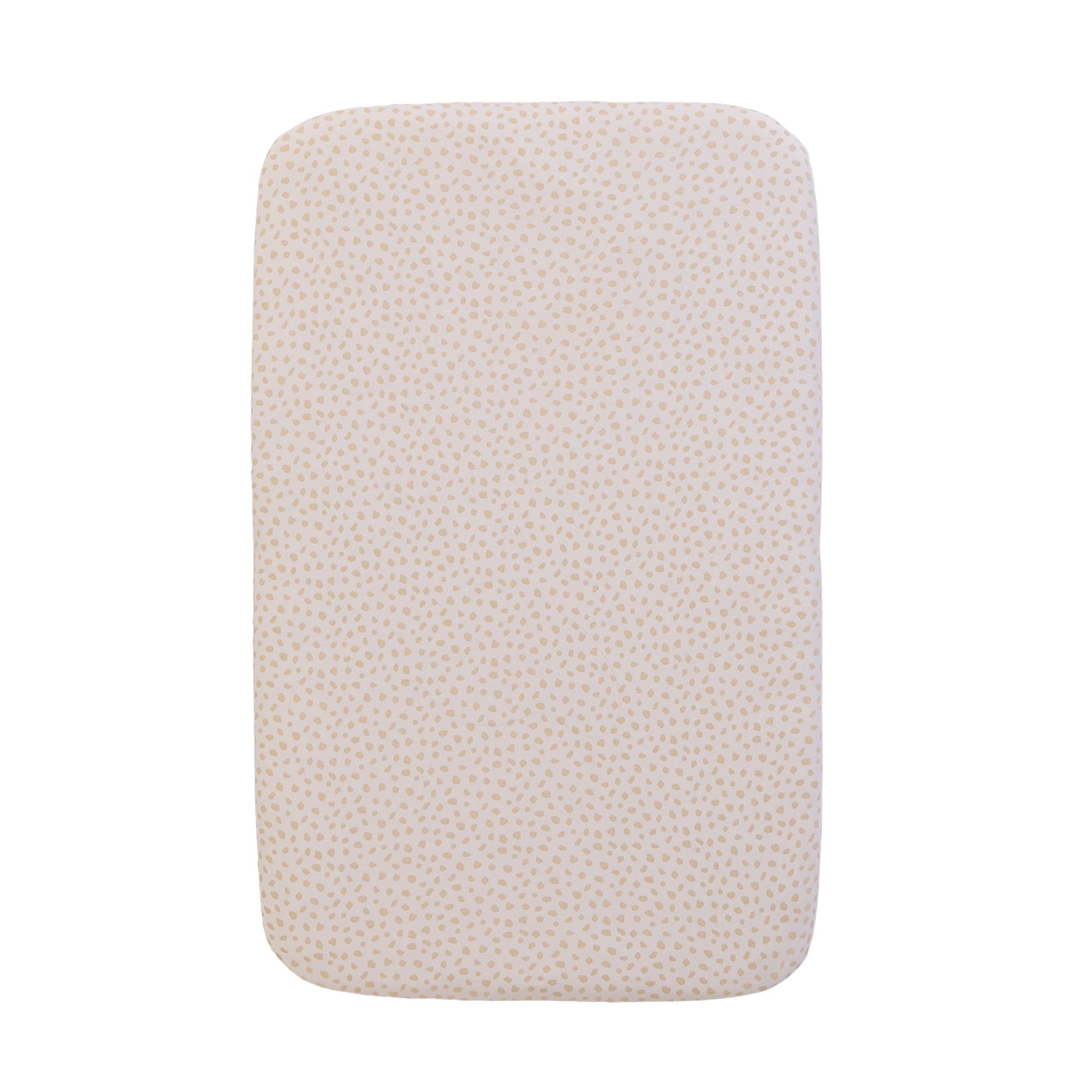 A bedside crib fitted sheets with an animal print, on a white background
