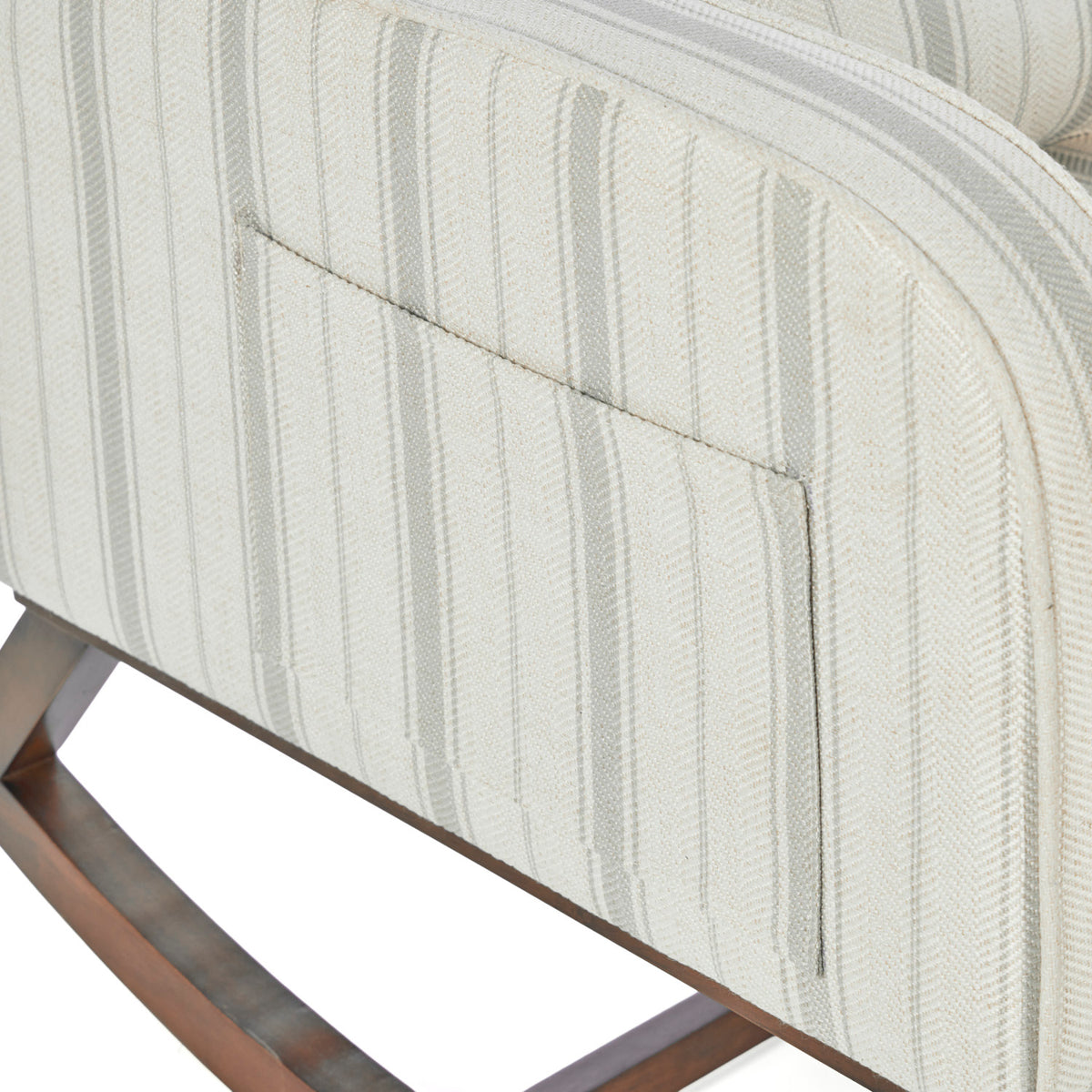 A close up of the pocket on the side of the Luca rocking chair in cashmere vintage stripe in a white background.