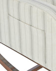 A close up of the pocket on the side of the Luca rocking chair in cashmere vintage stripe in a white background.
