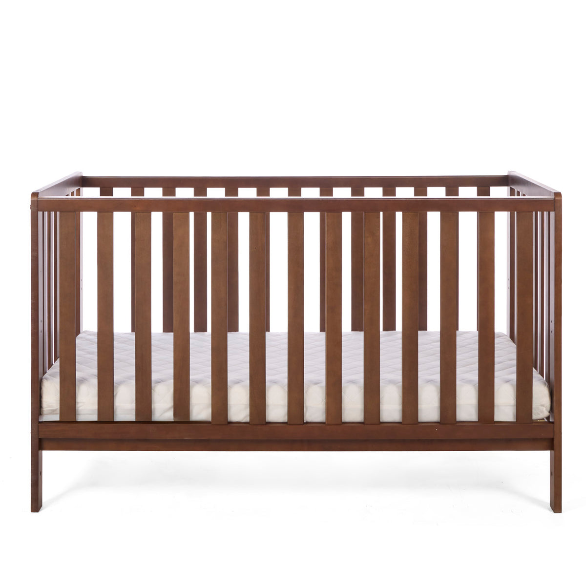 The Malmo cot bed in rich walnut with a mattress in a white background.