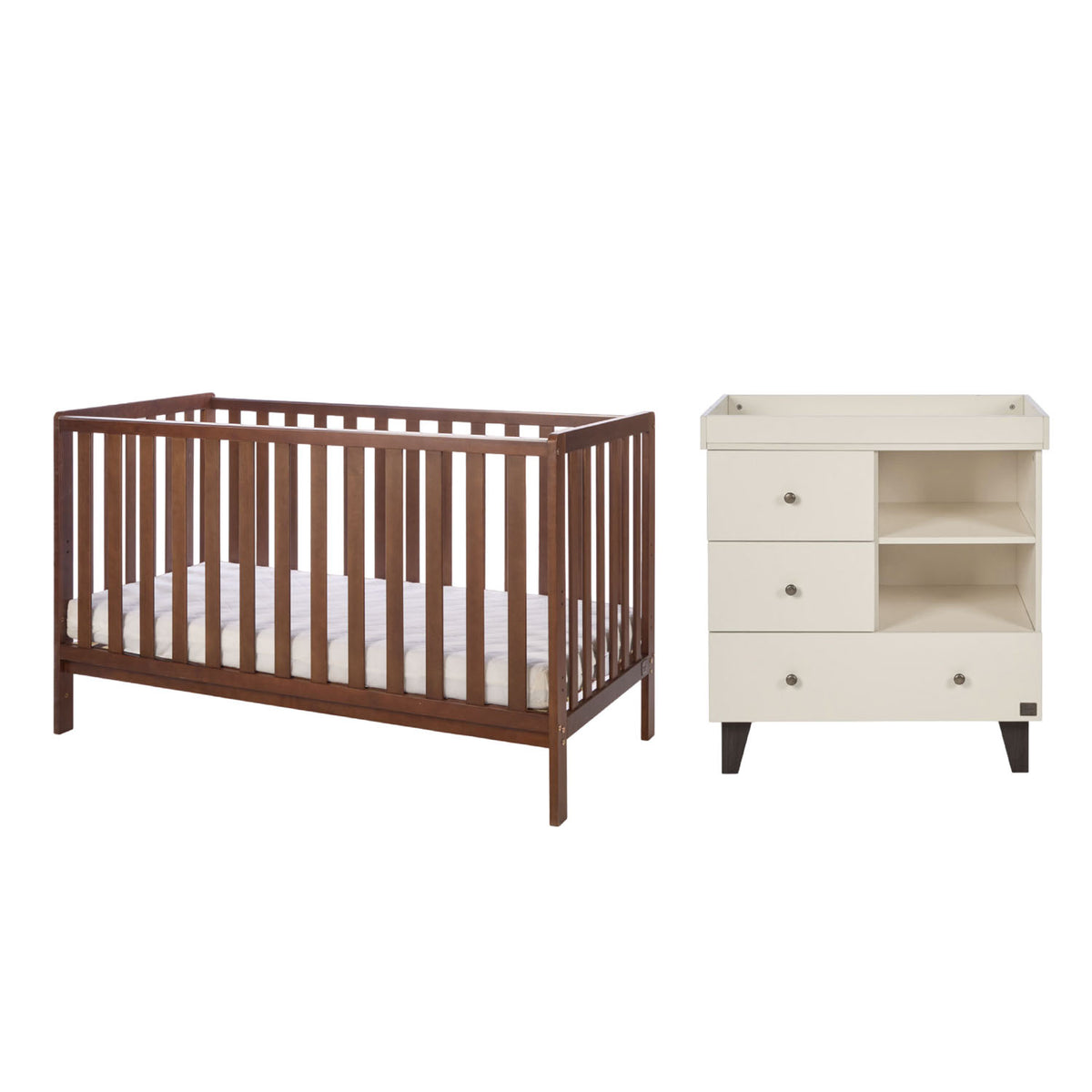 A cot bed in dark brown walnut wood and a changing table in a cream colour finish, shown on a plain white background.