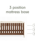 An infographic of a brown wooden and white cot bed with a mattress base shown on a white background, with text reading '3 position mattress base' and numbered heights 1, 2, and 3 indicating three mattress positions.