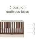 An infographic of a brown wooden and white cot bed with a mattress base shown on a white background, with text reading '3 position mattress base' and numbered heights 1, 2, and 3 indicating three mattress positions.