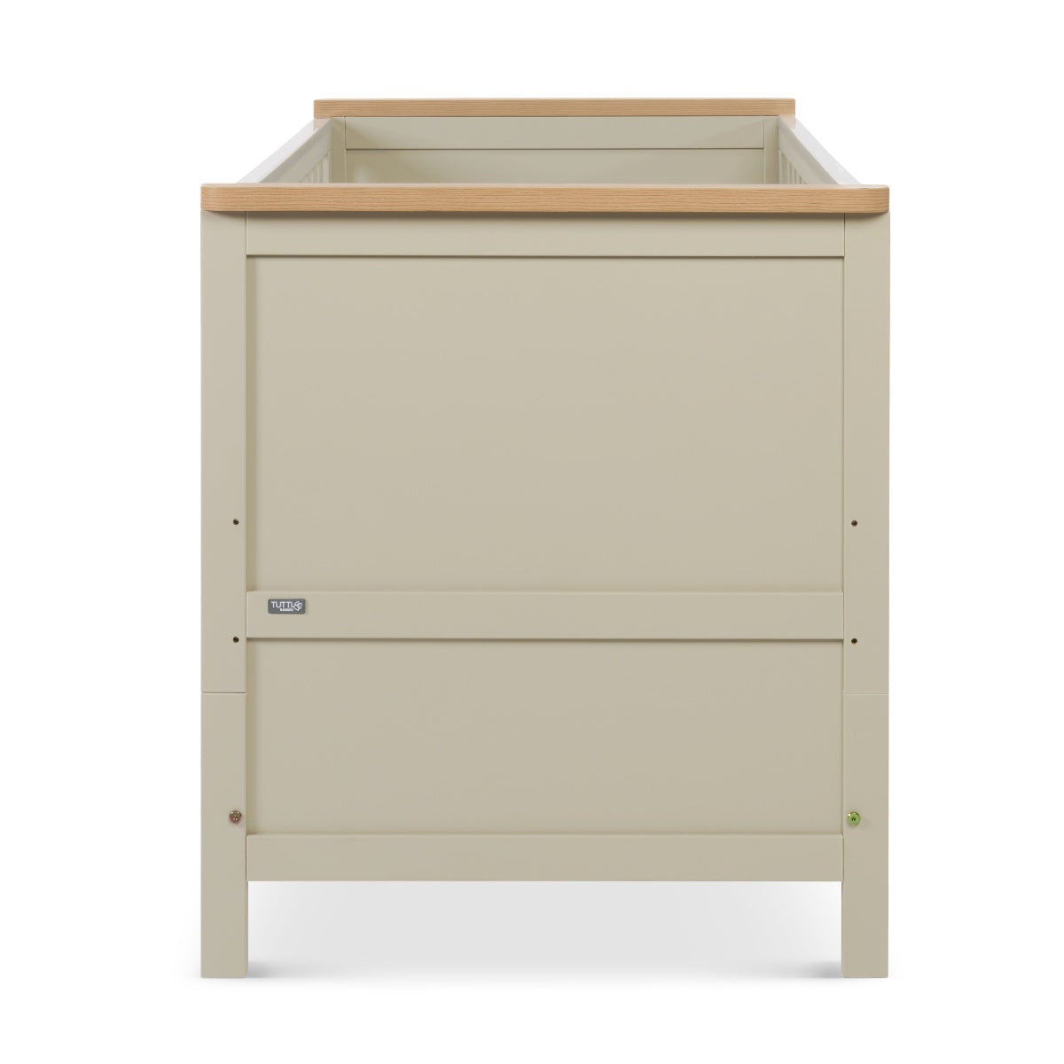 Side view of the Misha cot bed in mushroom finish with oak top rail, showcasing clean panel design and sturdy frame construction