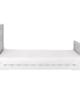 Modena Cot Bed in Grey Ash and White displayed in toddler bed configuration with safety sides removed, offering an open and easy-access sleep space.