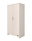 An angle view of a nursery wardrobe in white with closed doors, providing a sleek and contemporary storage solution for children's bedrooms, shown on white background. 