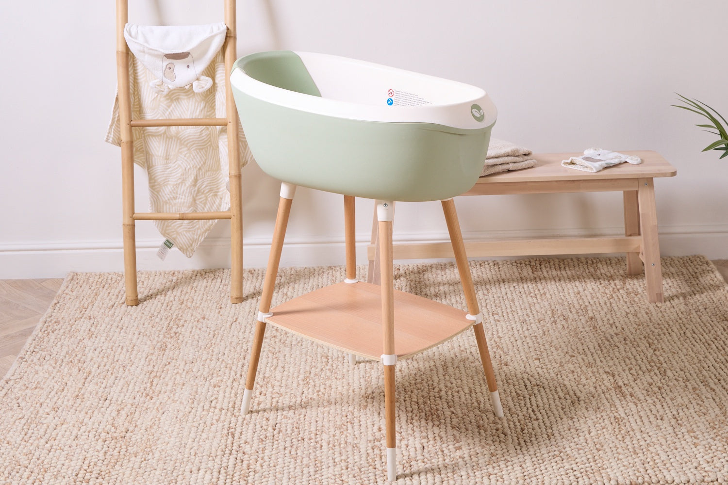 Nati Aloe baby bath shown on extendable baby stand
