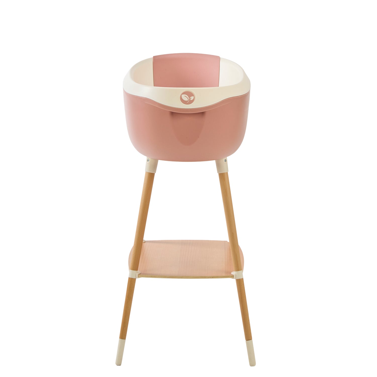 Front view of the Nati Baby Bath in pink on a wooden stand, in a white background.