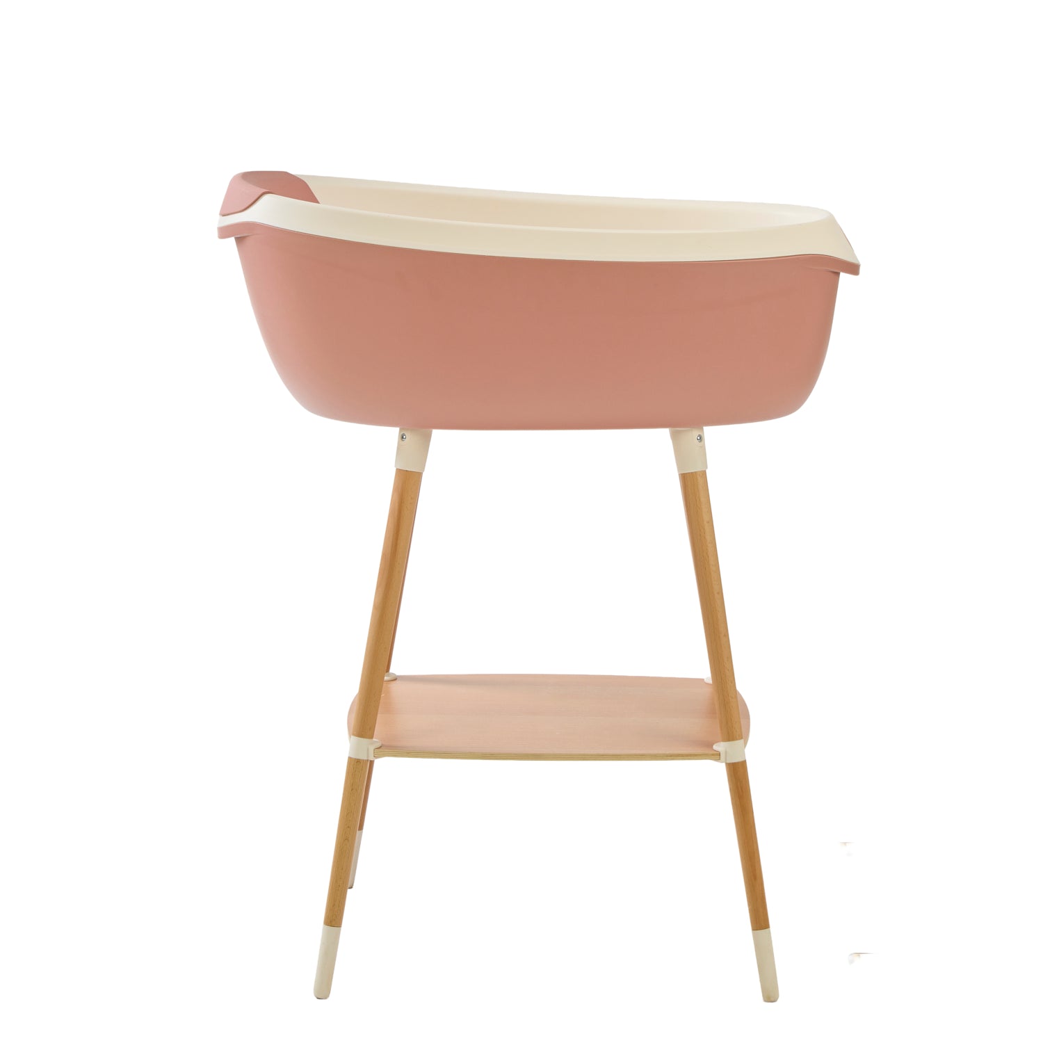 Pink and beige baby bath tub with wooden legs on a white background