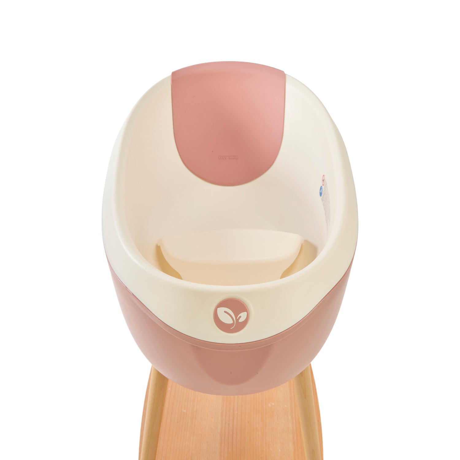 Inside view of the Nati Baby Bath with the silicone pad in Shell, placed on its wooden stand against a clean white background.