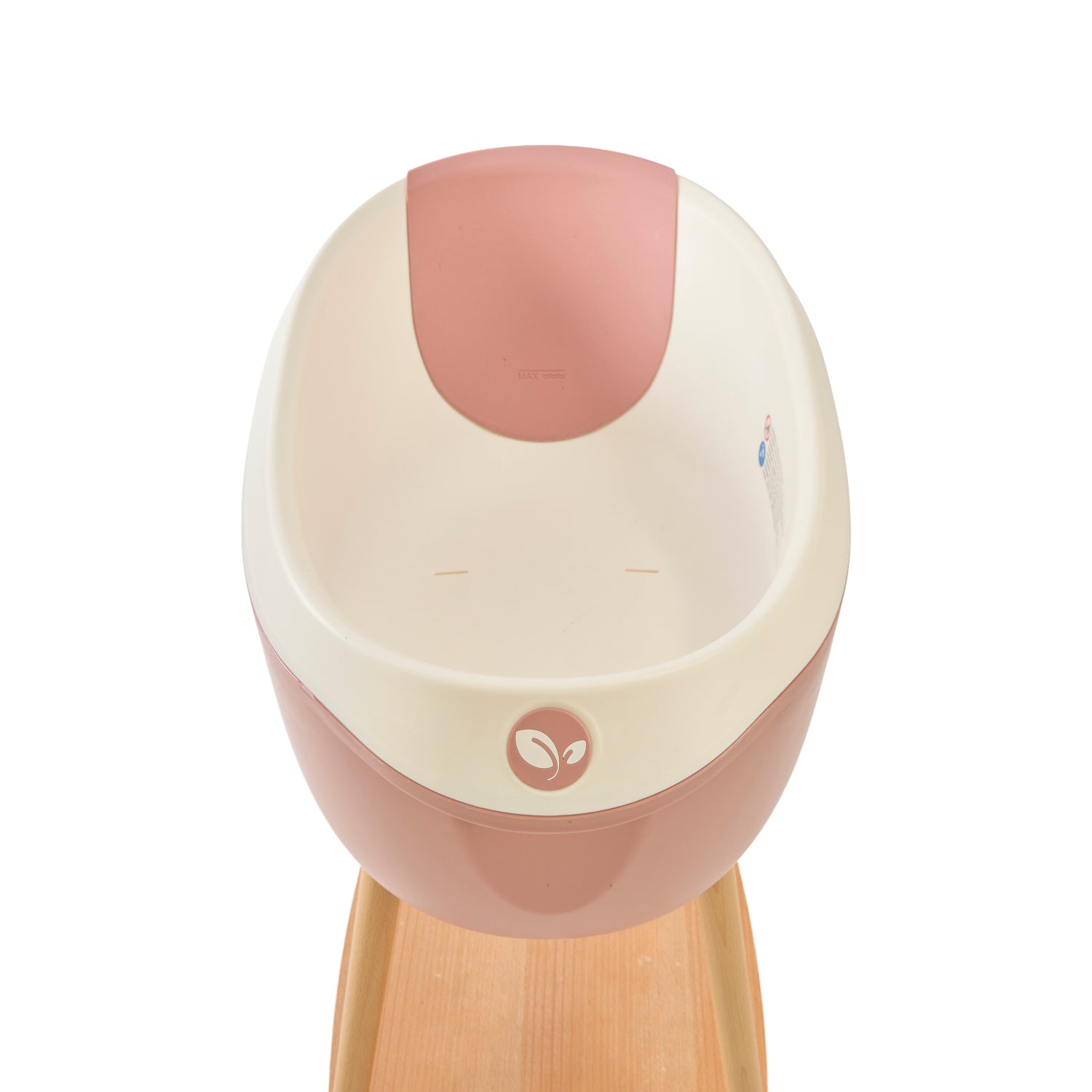 Inside view of the Nati Baby Bath with the silicone pad in Shell, placed on its wooden stand against a clean white background.