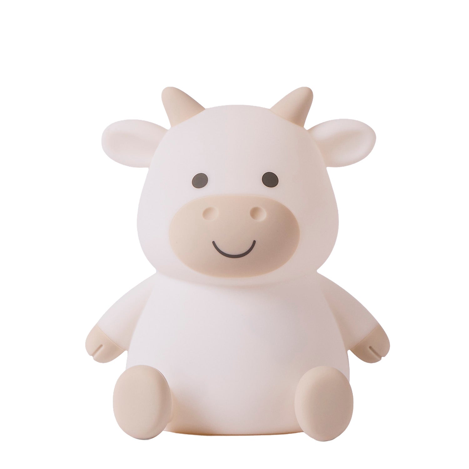 White cow-shaped night light on a white background