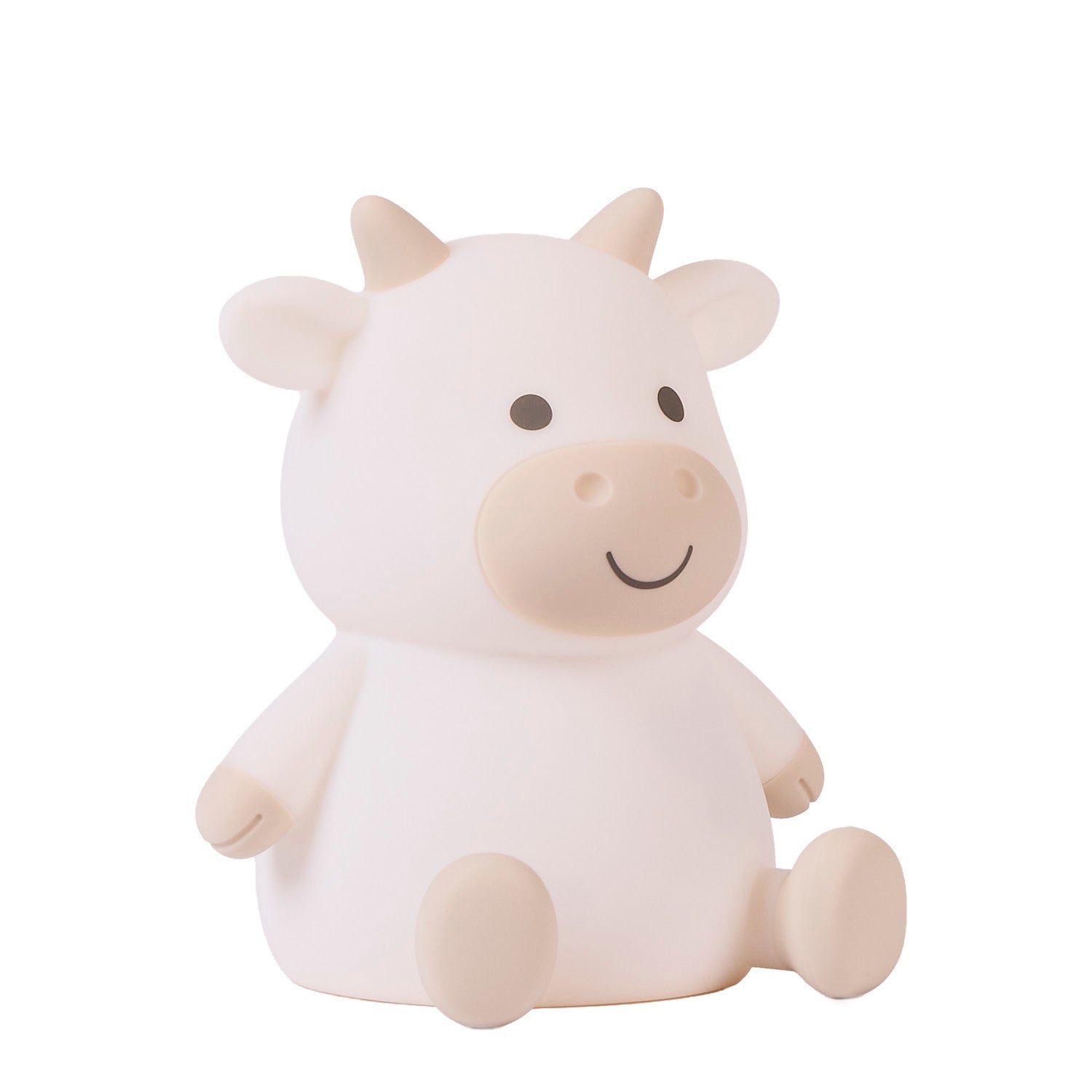 Side view of a white cow-shaped night light on a white background