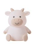 White cow-shaped night light on a white background