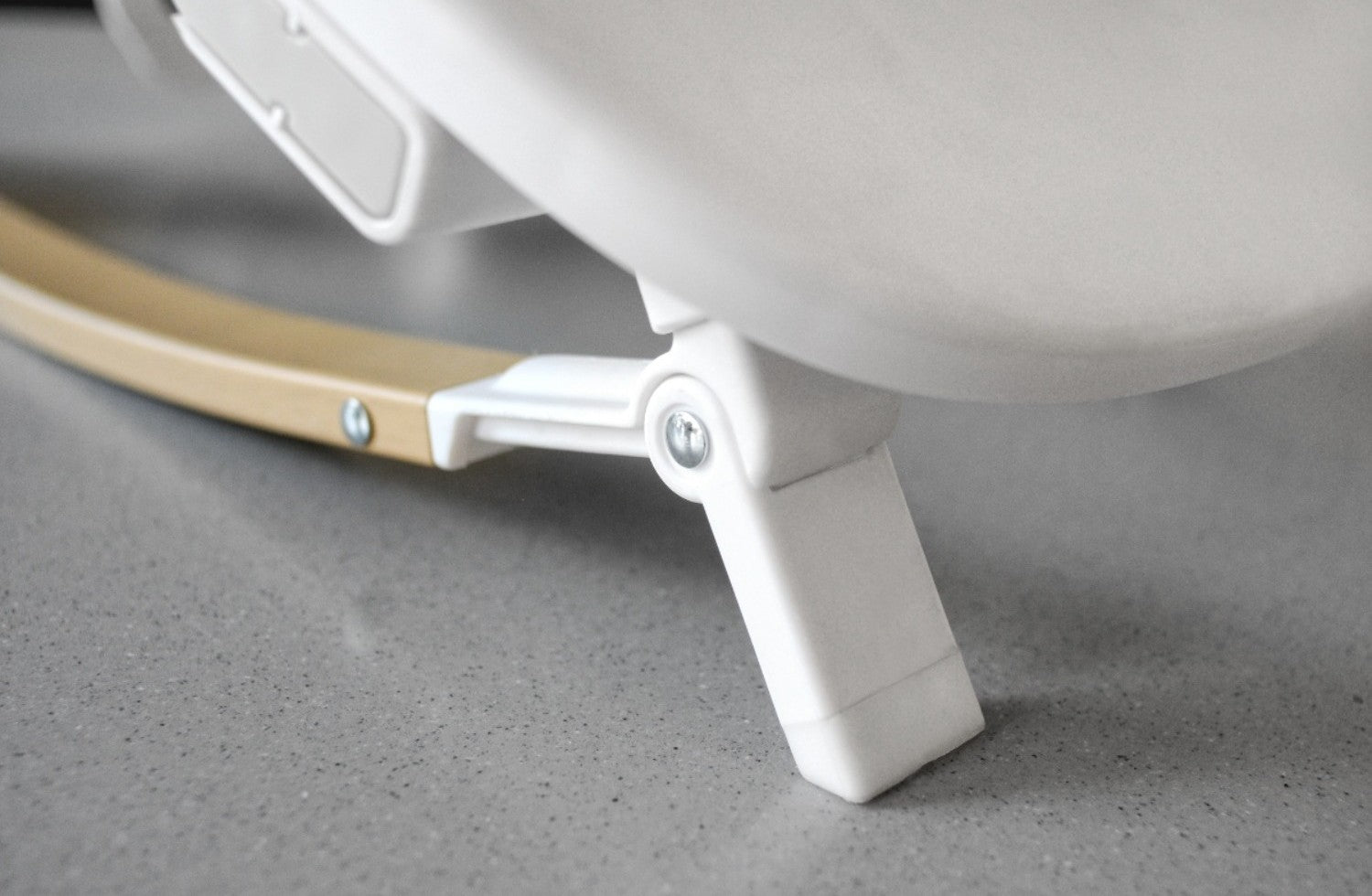 Detailed close-up of the Nova Rocker’s sturdy leg and curved wooden base, showing secure support for everyday use.