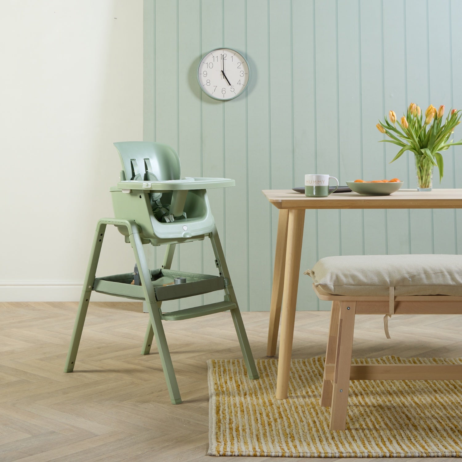Styled kitchen scene featuring the nova maison 7 in highchair in matcha, showing how it fits seamlessly into calm, modern family spaces.