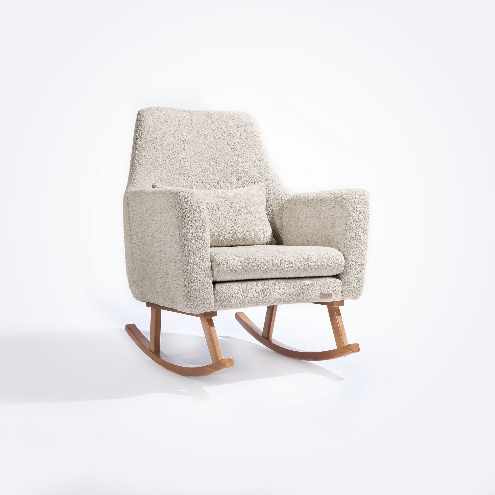 Angled front cutout of the Oscar Luxe Rocking Chair in boucle sage, highlighting softly rounded seat and plush matching cushion.