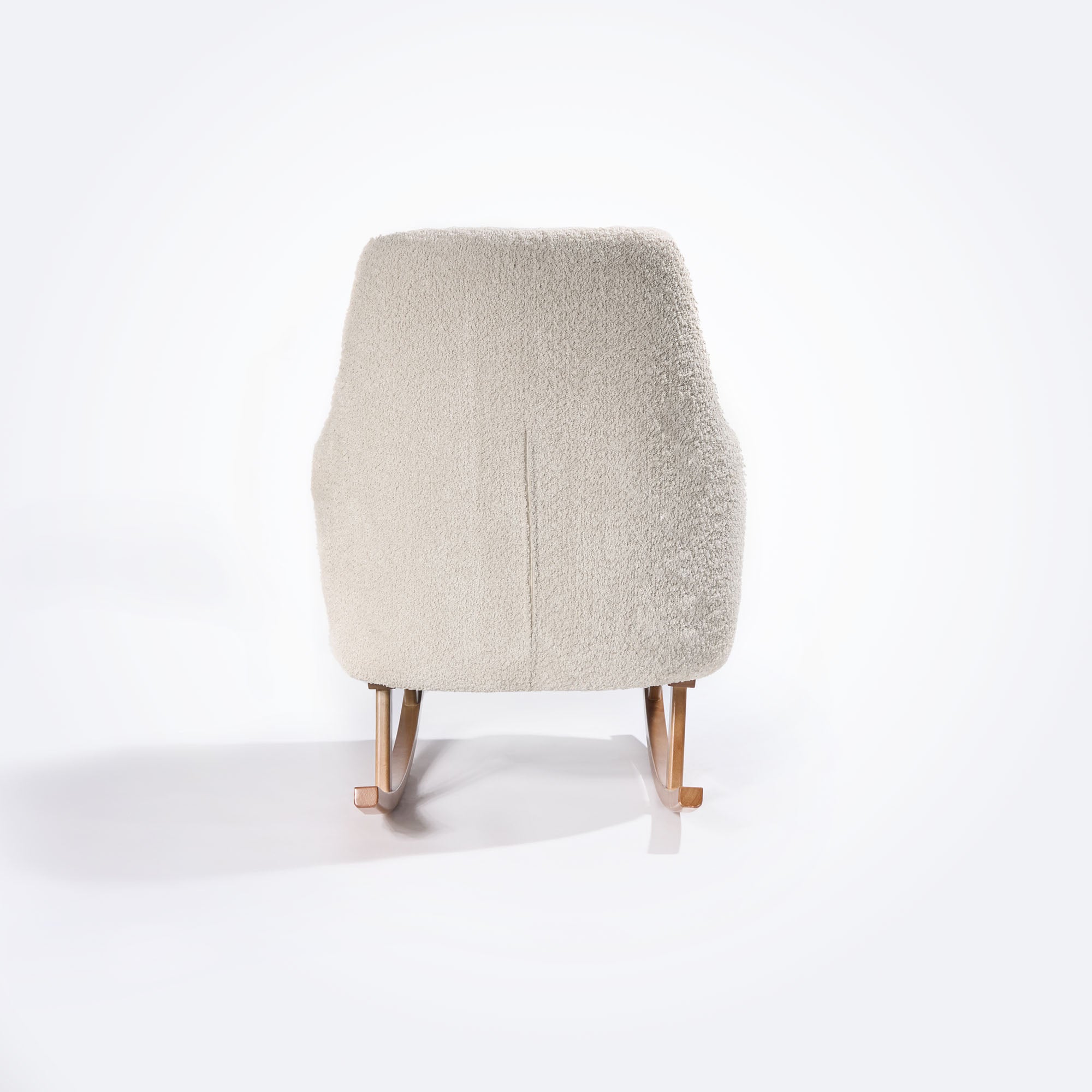 Rear view of the Oscar Luxe Rocking Chair in boucle sage, showcasing curved backrest and smooth oak rocking legs.