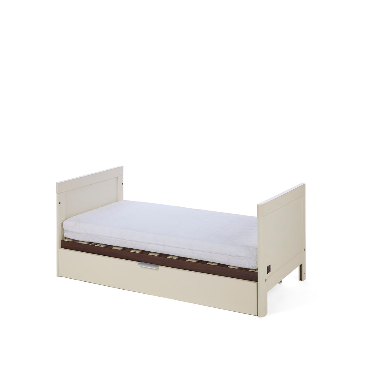 The Riley mIni cot bed in cashmere and rich walnut in toddler bed mode on a white background.