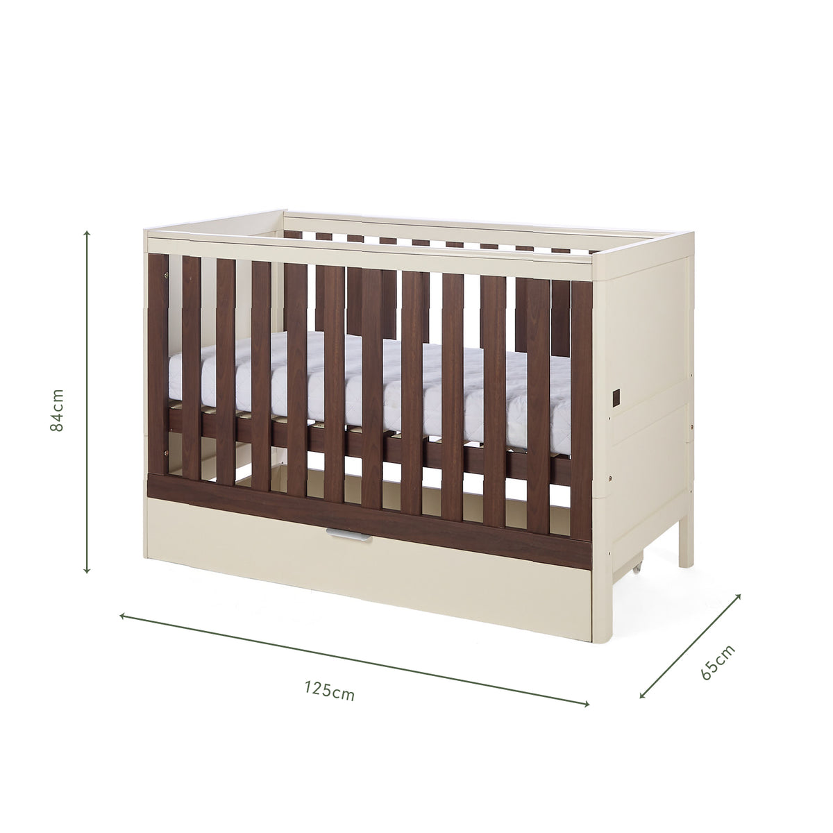 An infographic of a white cot bed with wooden panels showing dimension markings of 125 cm length, 65 cm width, and 84 cm height, on a plain white background.