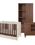 A 3-piece nursery furniture set featuring a cot bed, changing table, and wardrobe in a warm walnut wood finish with cream-colored accents, shown on a solid white background.