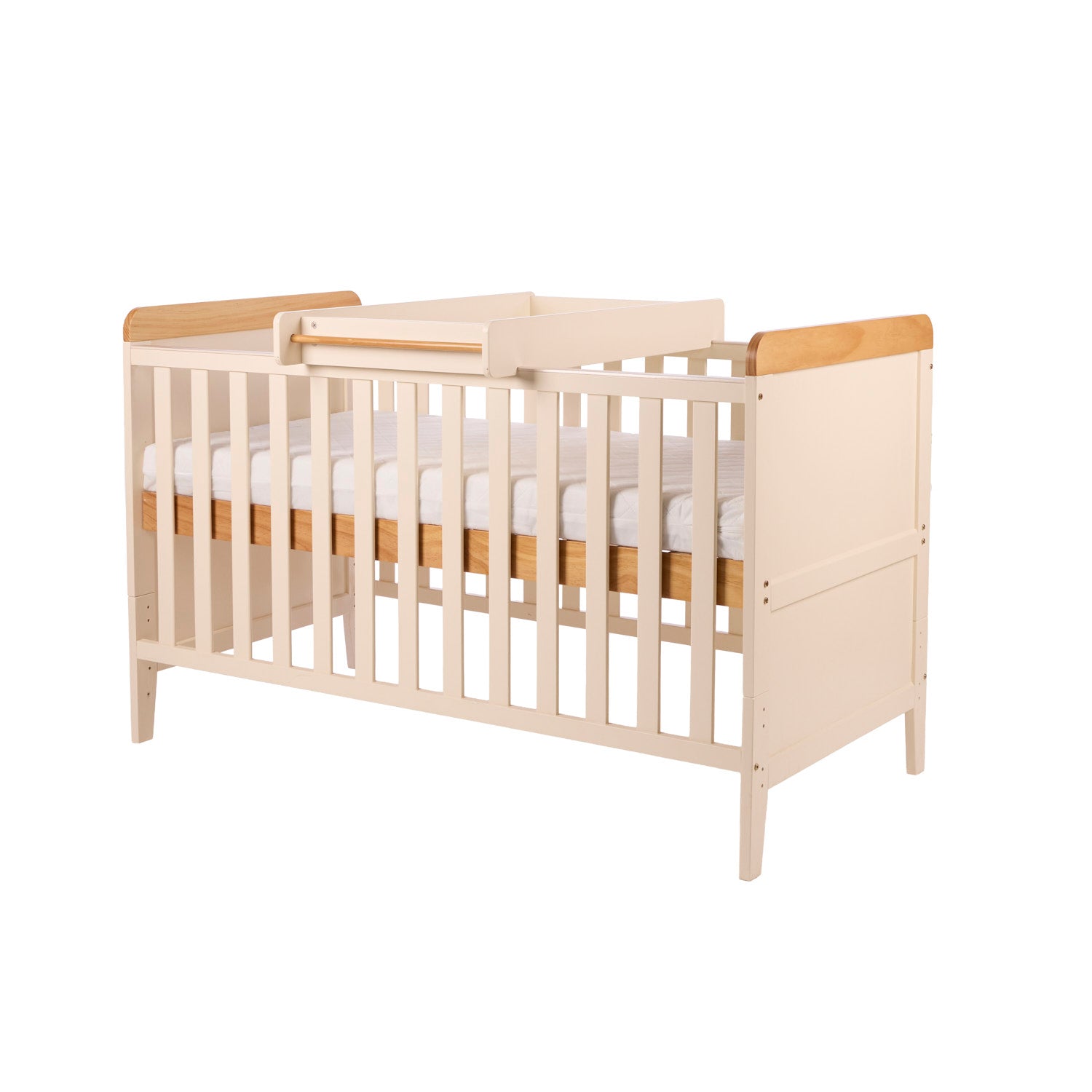 Rio cot bed with cot top changer in Cahsmere and Oak with a white mattress on a white background