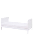 Side view of the Rio Cot Bed in white converted into a toddler bed suitable for children from 2 to 6 years.