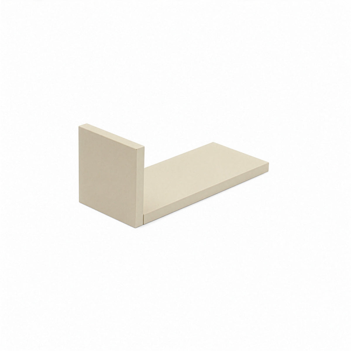A close-up view of the L-shaped wall shelves in cashmere showing the small sized shelf.
