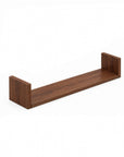 A close-up view of the U-shaped wall shelves in walnut showing the large sized shelf.