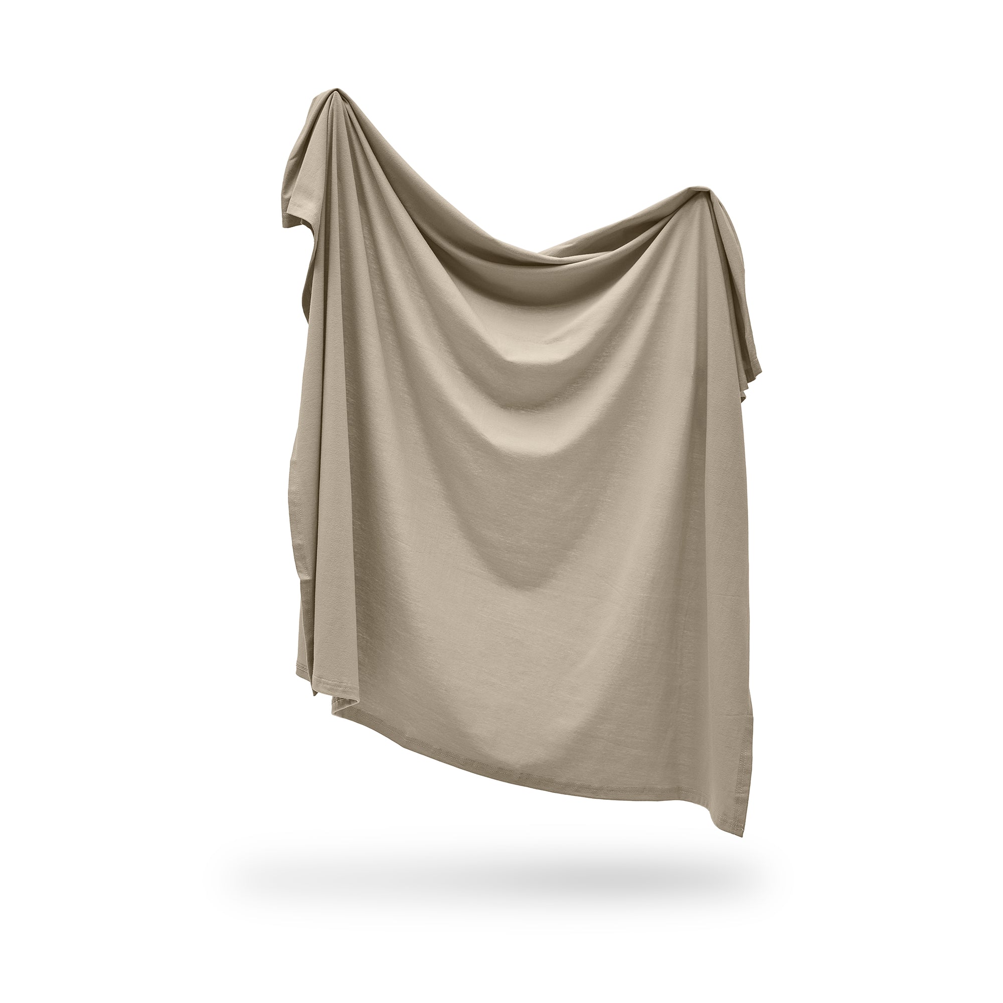 Beige swaddle draped over a white background