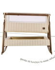 An infographic of a baby bedside crib with cream striped fabric panels and a mesh upper screen, shown on a white background with overlaid text and arrows explaining the gentle tilt function to ease reflux.