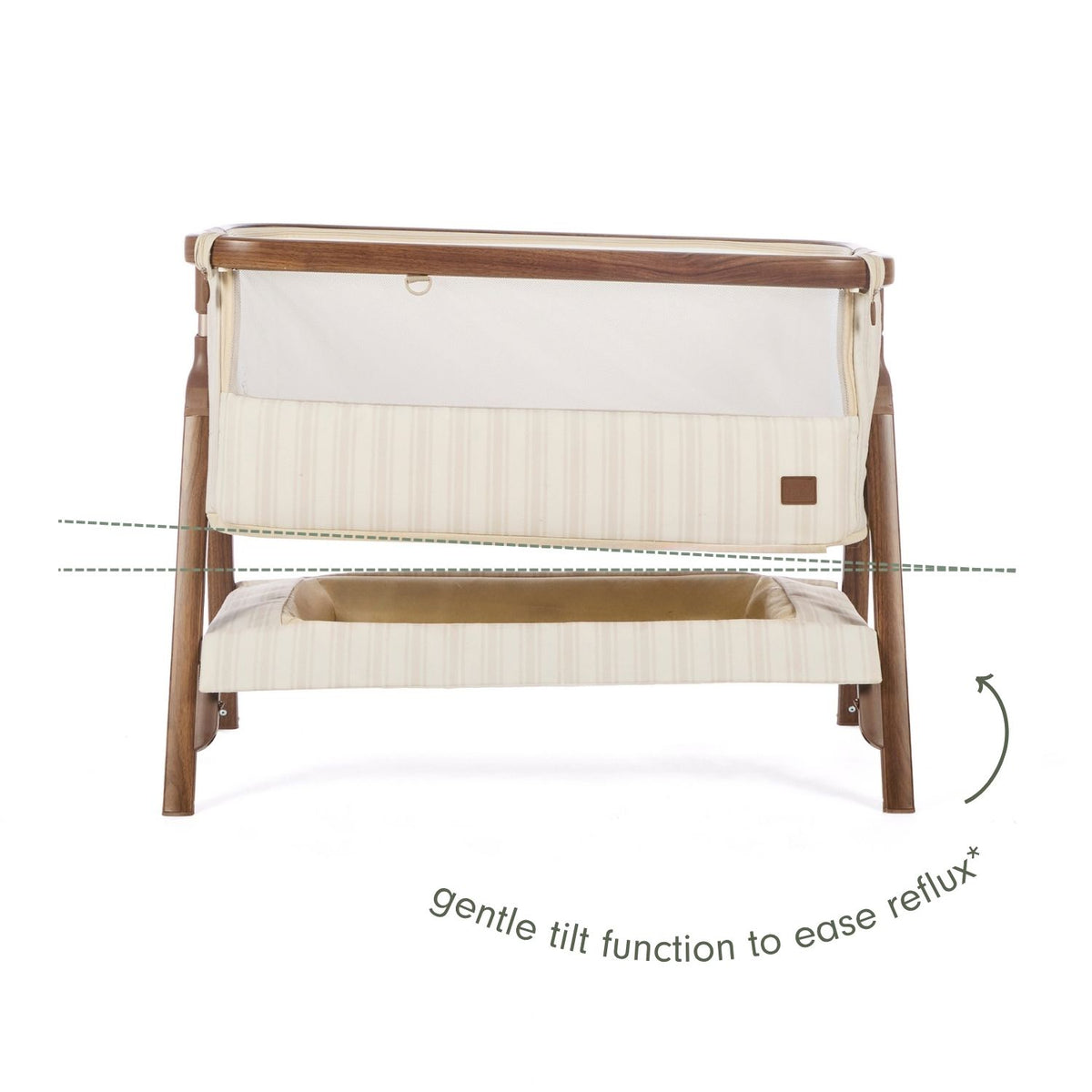 An infographic of a baby bedside crib with stiped cream-colored fabric panels and a matching base, shown on a white background with a dashed horizontal line indicating the tilt function and text reading 'gentle tilt function to ease reflux'.