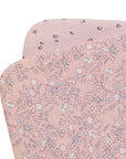 Pack of 2 bedside crib fitted sheets with a floral-patterned fabric and a strawberry one, on a white background