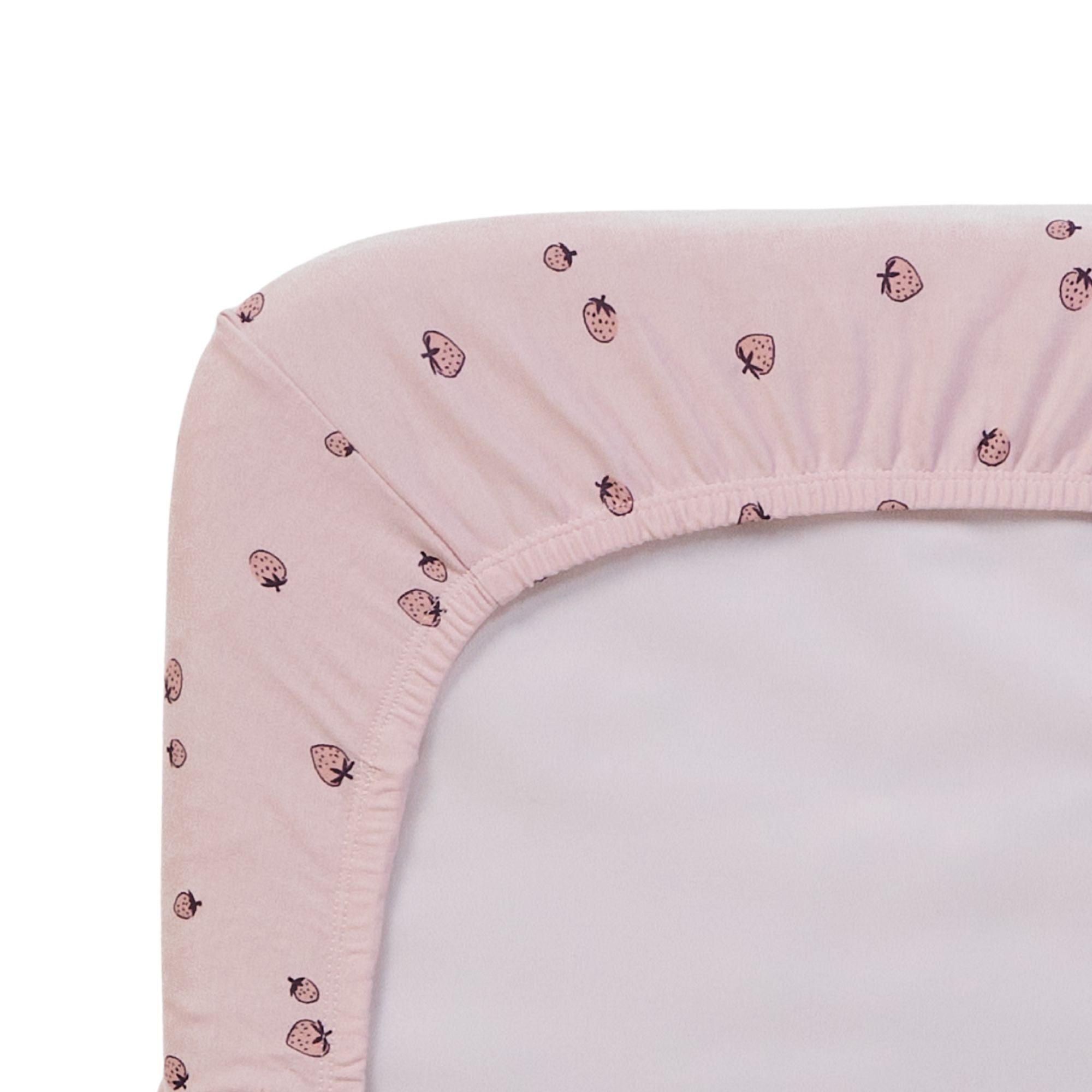 Close-up of the Tiny Tails pink crib sheet with a strawberry pattern on a white background