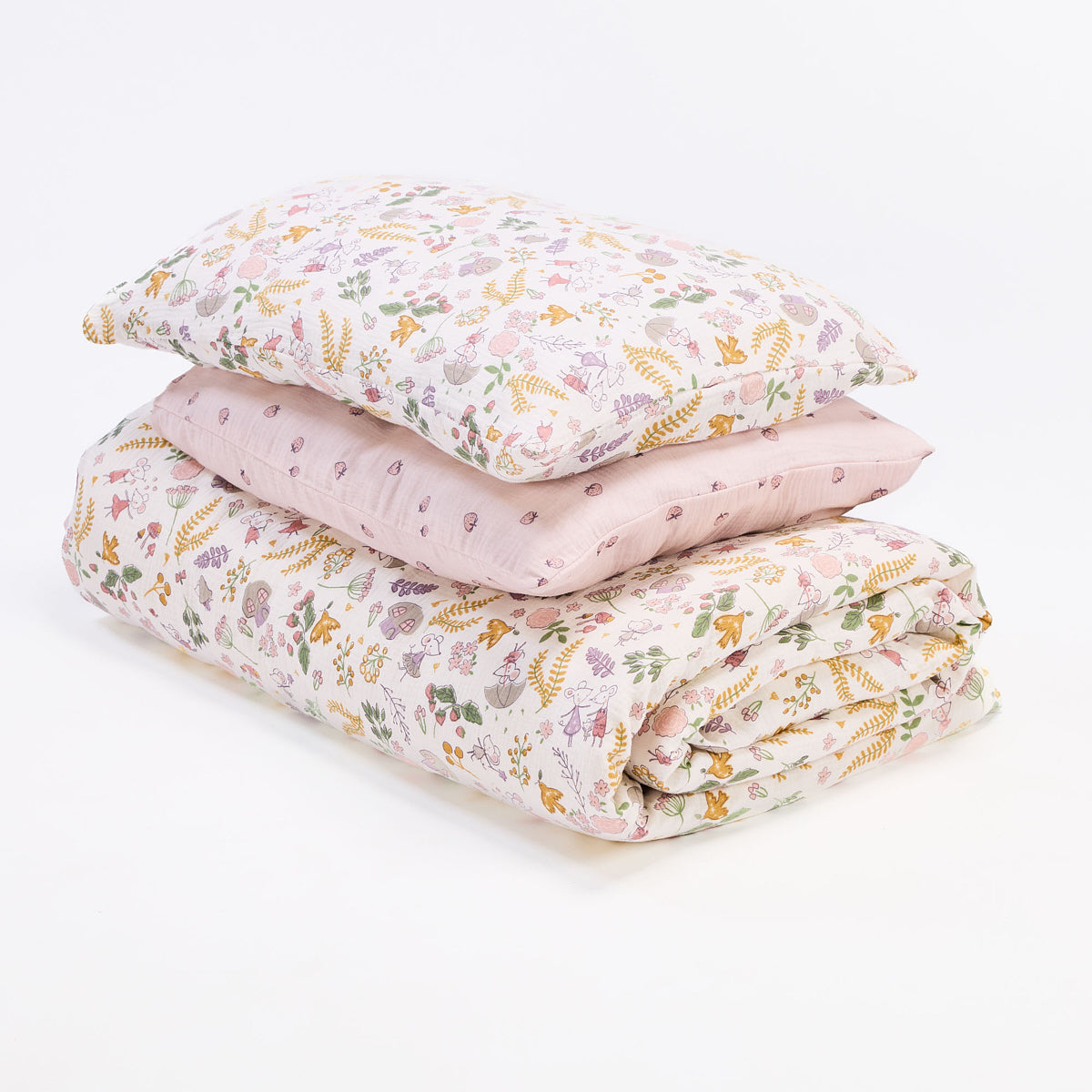 Cutout of Tiny Tails single duvet cover and pillowcase set showing reversible woodland and pink berry prints in breathable, lightweight muslin cotton