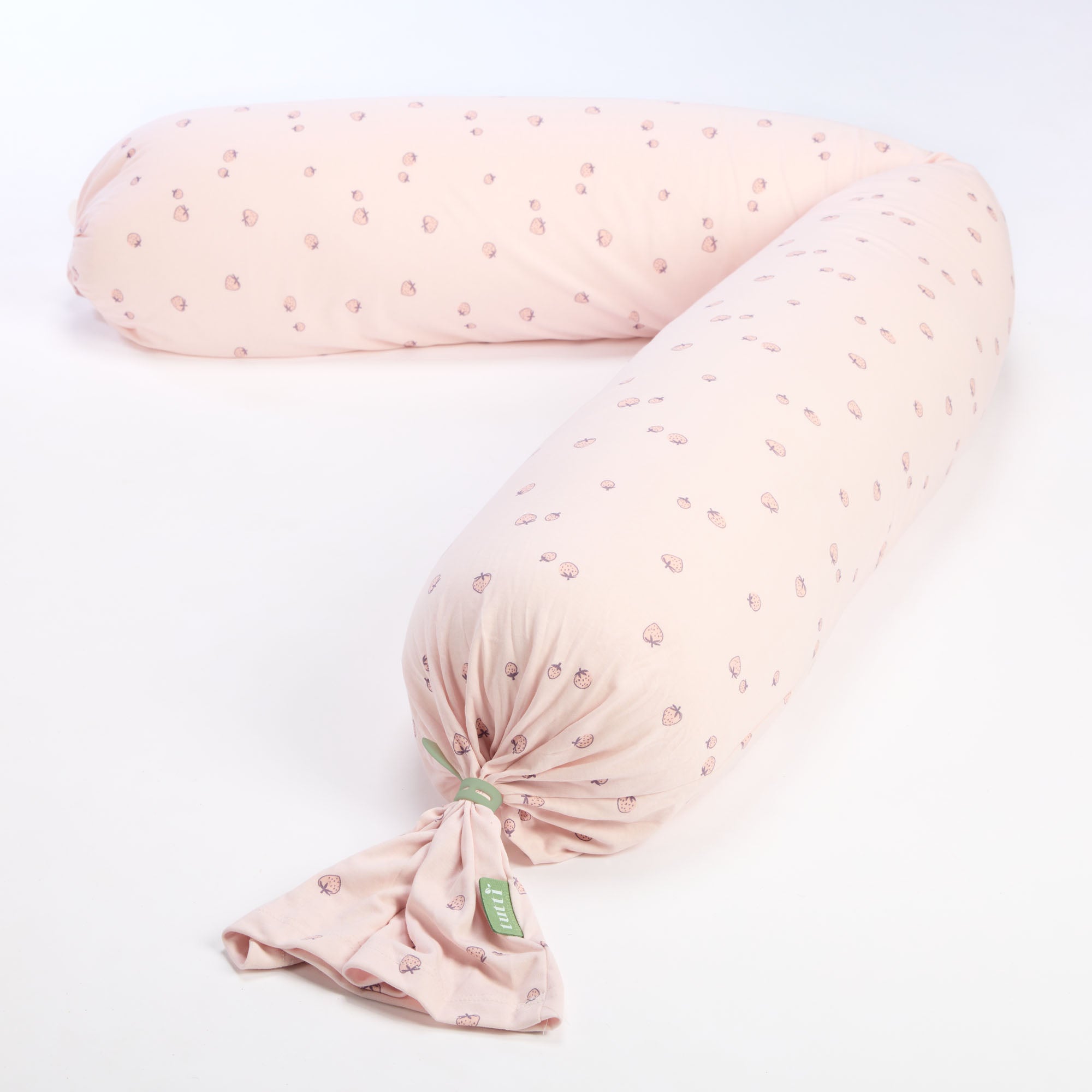 Tiny Tails pink U-shaped pregnancy pillow with a subtle pattern on a white background